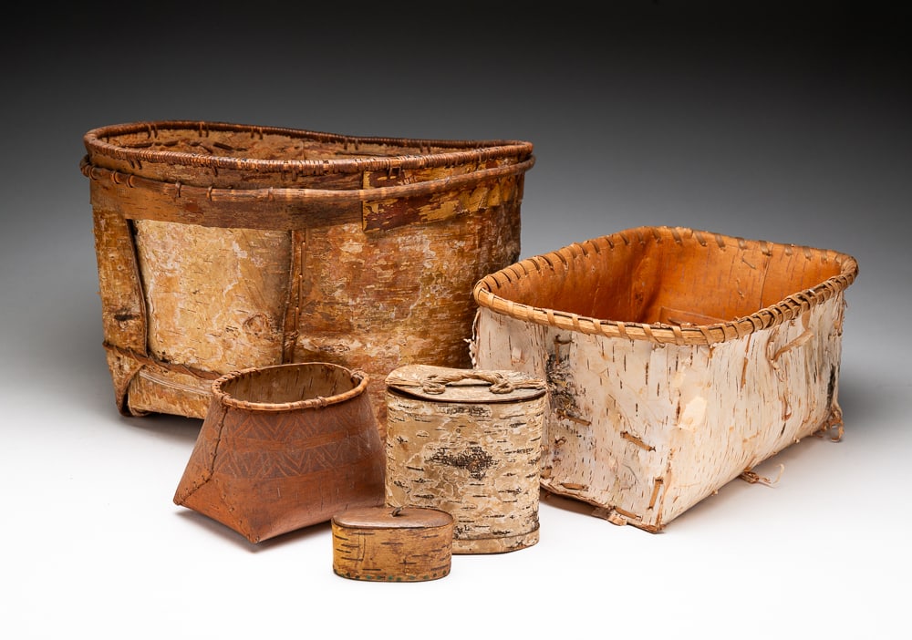 FIVE BIRCH BARK BASKETS.: Early- to late-19th Century. Ranging from small to medium size, one a Penobscot, one a possible early snuff box with wooden top. Overall fine condition with some fading and minor breaks. Largest 9"h. 