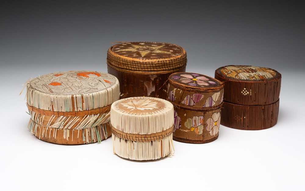 FIVE PORCUPINE QUILL BARK BOXES.: Canadian, late-19th or early-20th Century. Decorated throughout in various motifs with porcupine quills. Overall fair to good condition with quill separation on some boxes. Largest 4"h. 5"dia. Smalles