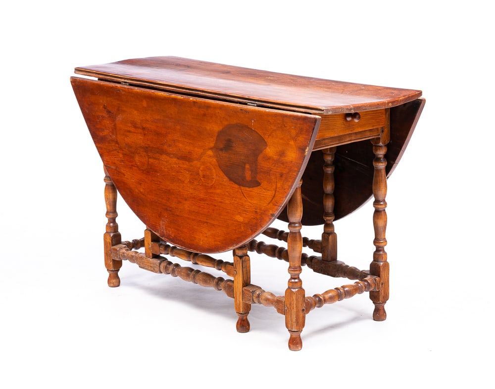 WILLIAM AND MARY GATE LEG TABLE.: American, first half 18th Century. Pine and maple. Oval top. Dovetailed drawer and nicely turned legs and stretchers. Refinished, age splits and repairs. 26.75"h. 44.75"w. 50.25" open with 17.5" leave