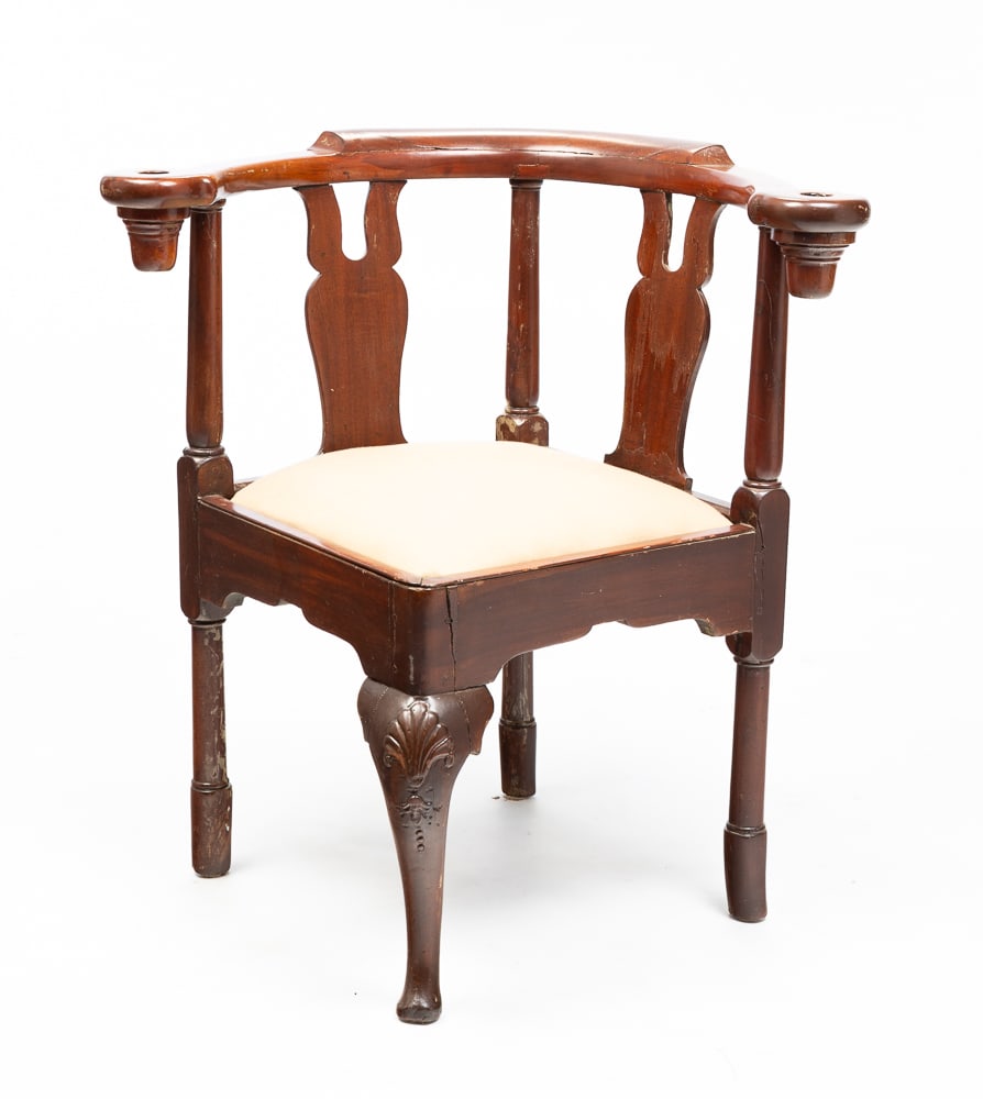 QUEEN ANNE CORNER CHAIR.: English, mid-18th Century. Mahogany. "U" shaped back, round arm and with cups, turned stiles and back legs. Bootjack splat, cabriole front legs with shell carved knee and pad foot. Refinished with glu