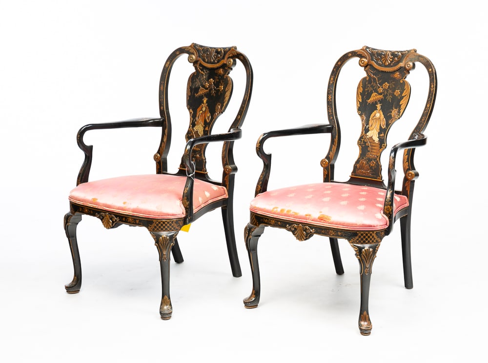QUEEN ANNE ARM CHAIRS WITH CHINOISERIE DECORATION.: English, first half 20th Century. Shaped crest with carved scrolls, decorated oblong splat, cabriole front legs with pad feet and pink satin upholstered seat. Wear to seats and finish wear. Seat 16"h.