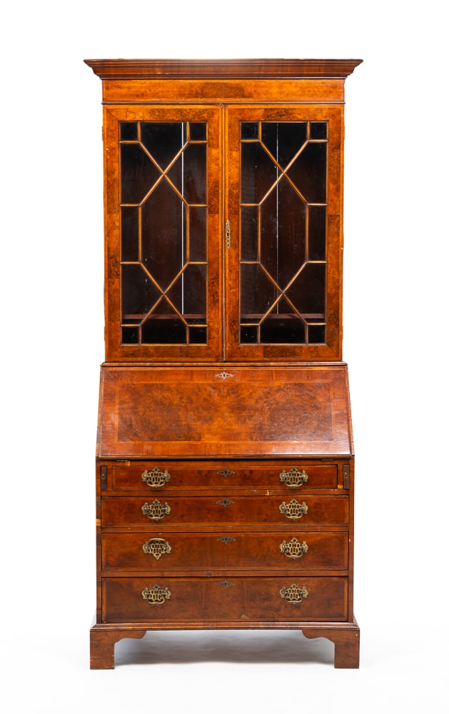 CHIPPENDALE STYLE INLAID SECRETARY BOOKCASE.: English, late-19th Century. Mahogany with pine secondary. In two pieces. Top with molded cornice and doors with geometric traceries. Slant front base, four dovetailed drawers, bracket feet and fitted 
