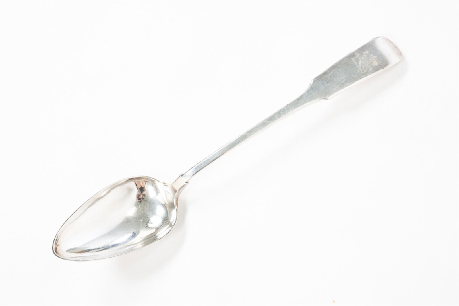 STERLING SILVER STUFFING SPOON.: Continental, first half 19th Century. Fiddleback handle with engraved griffin. Marked "AFC" to back. Surface wear and dents. 14.5"l. Approximately 5ozt.