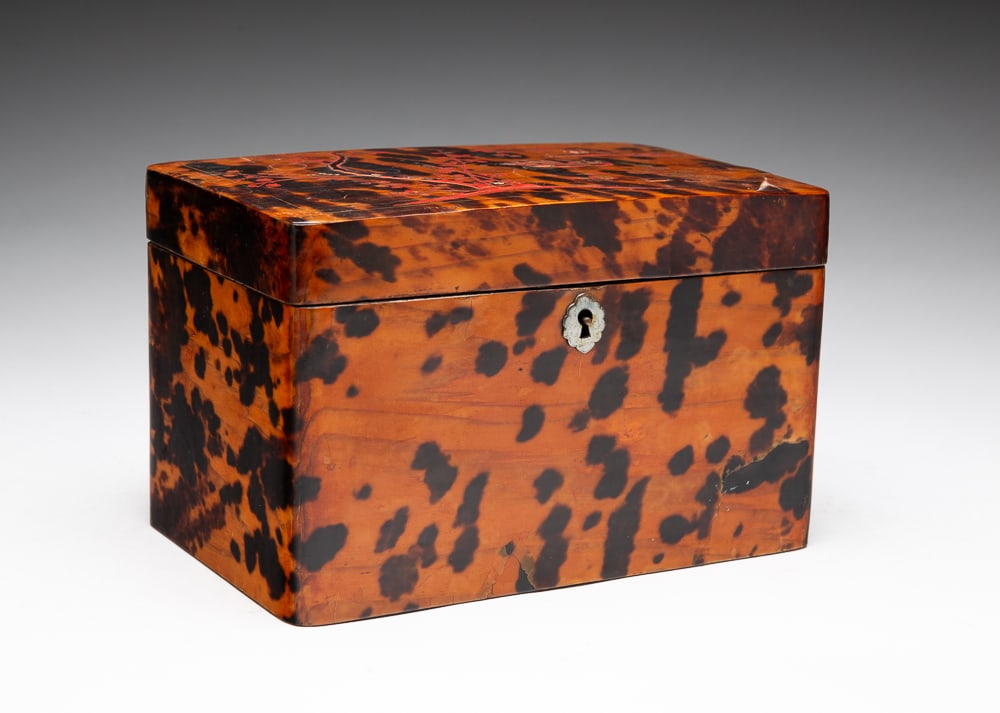 TORTOISESHELL VENEERED TEA CADDY.: English, mid-19th Century. Cherry blossoms and ducks painted top. Opens to a single compartment with two hinge lid boxes with veneered tops. Cracks, splits, lacquer damage and paint loss. 4.5"h. 7.25"