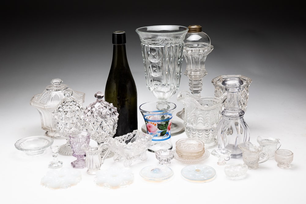 GROUPING OF GLASS.: American, second half 19th Century. Includes a lidded patterned glass sugar, two lidded egg cups, a footed glass lamp, paint decorated cup and a grouping of miniature glass pieces. Varying wear.