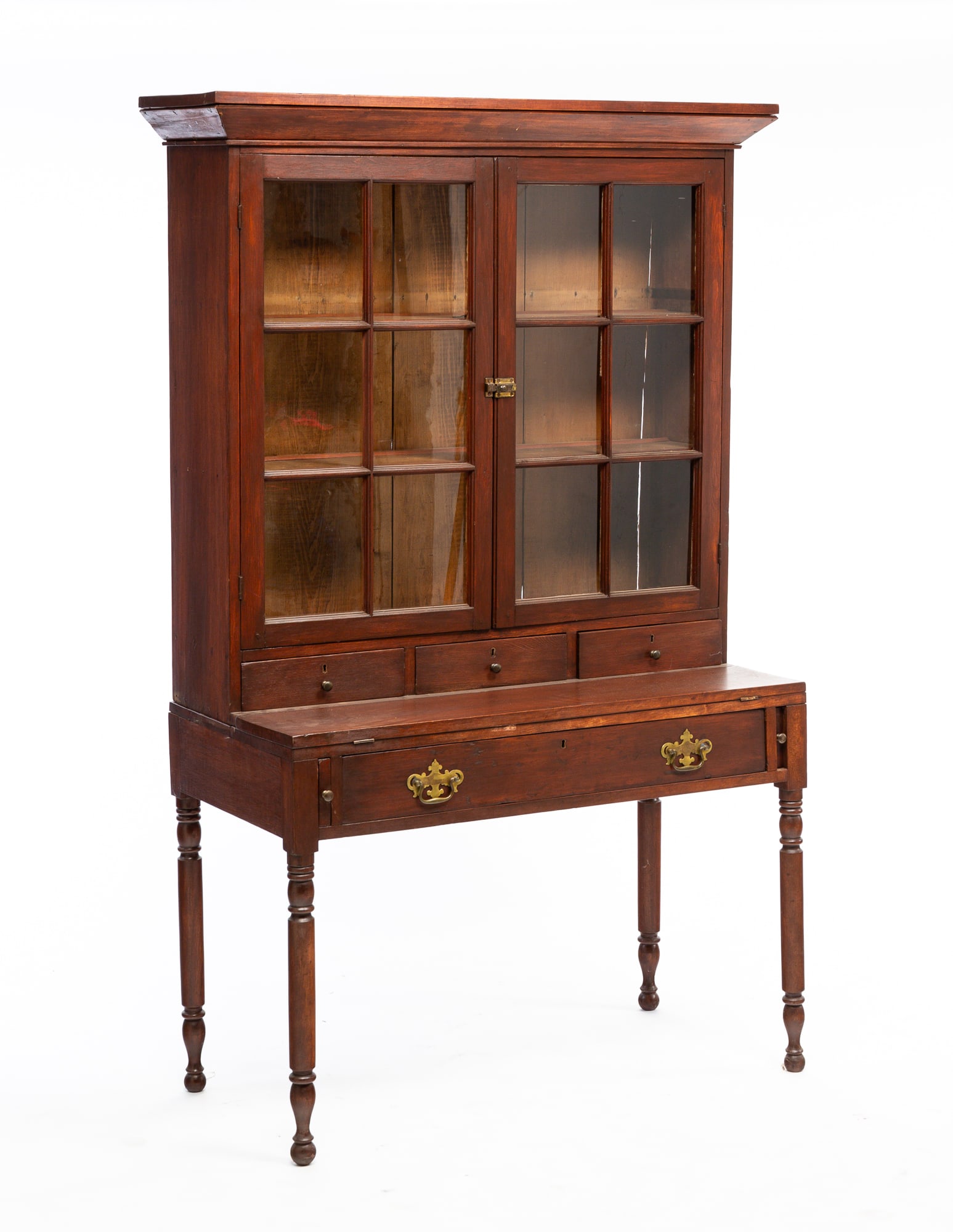 SHERATON PLANTATION DESK.: American, second quarter 19th Century. Pine and poplar. In two pieces. Top with beveled cornice, two six pane with fold down writing surface, dovetailed drawer and turned legs. Refinished with some mi