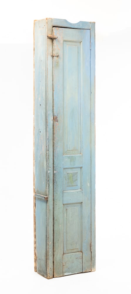 PAINTED CHIMNEY CUPBOARD.: American, second quarter 19th Century. Pine and oak. Opening with beaded edge, single door with three raised panels and original blue paint. Back and right end are replaced using old lumber. Missing o