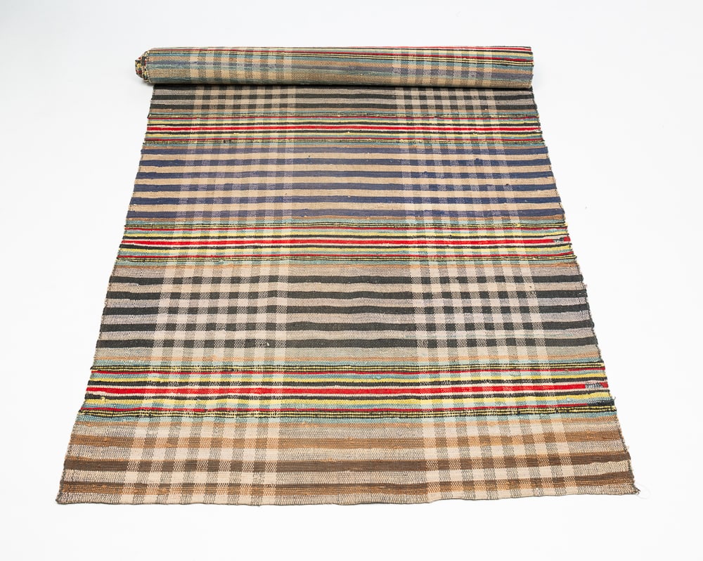 RAG RUG RUNNER.: American, first half 20th Century. Multi-colored stripe and checkerboard pattern. Edge and binding wear, stains, few spots of loss and repairs. 15'3"l. 3'5"w.