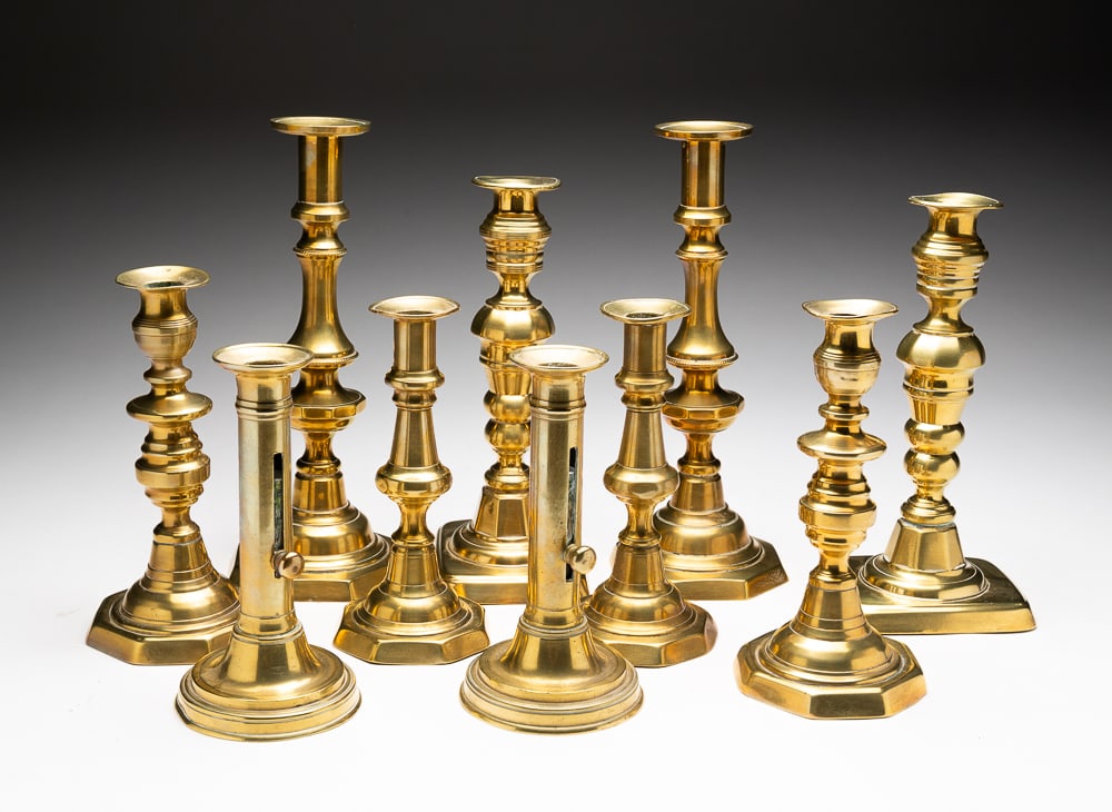 VICTORIAN BRASS CANDLESTICK GROUPING.: English and American, second half 19th Century. Five matching pairs, one with push-ups. In varying forms. 10.75"h. to 7"h.