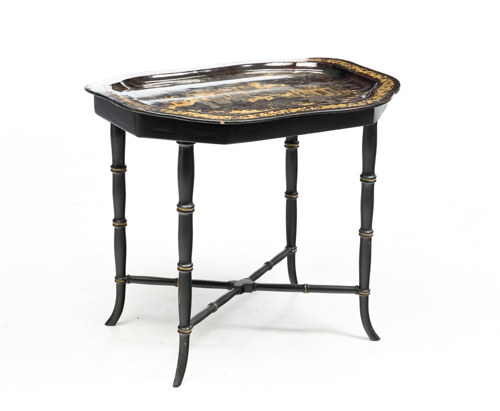 CHINOISERIE TRAY ON STAND.: American (Mid-Atlantic states), fourth quarter 19th Century. A Papier-Mache lacquered tray with gold detailing on a modern faux bamboo base with "X" stretcher. Surface wear, paint loss and edge restor