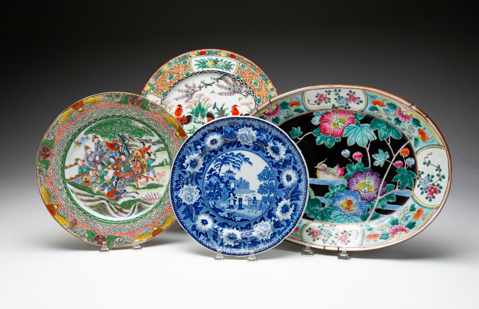 FOUR PIECES OF ASIAN CERAMICS.: Chinese, mid-19th Century. Blue transferware plate with Asian scene, 8"dia. Two polychrome plates, one with roosters and the other with soldiers. Marked to backs. 10" and 10.25"dia. And a Tobacco Leaf