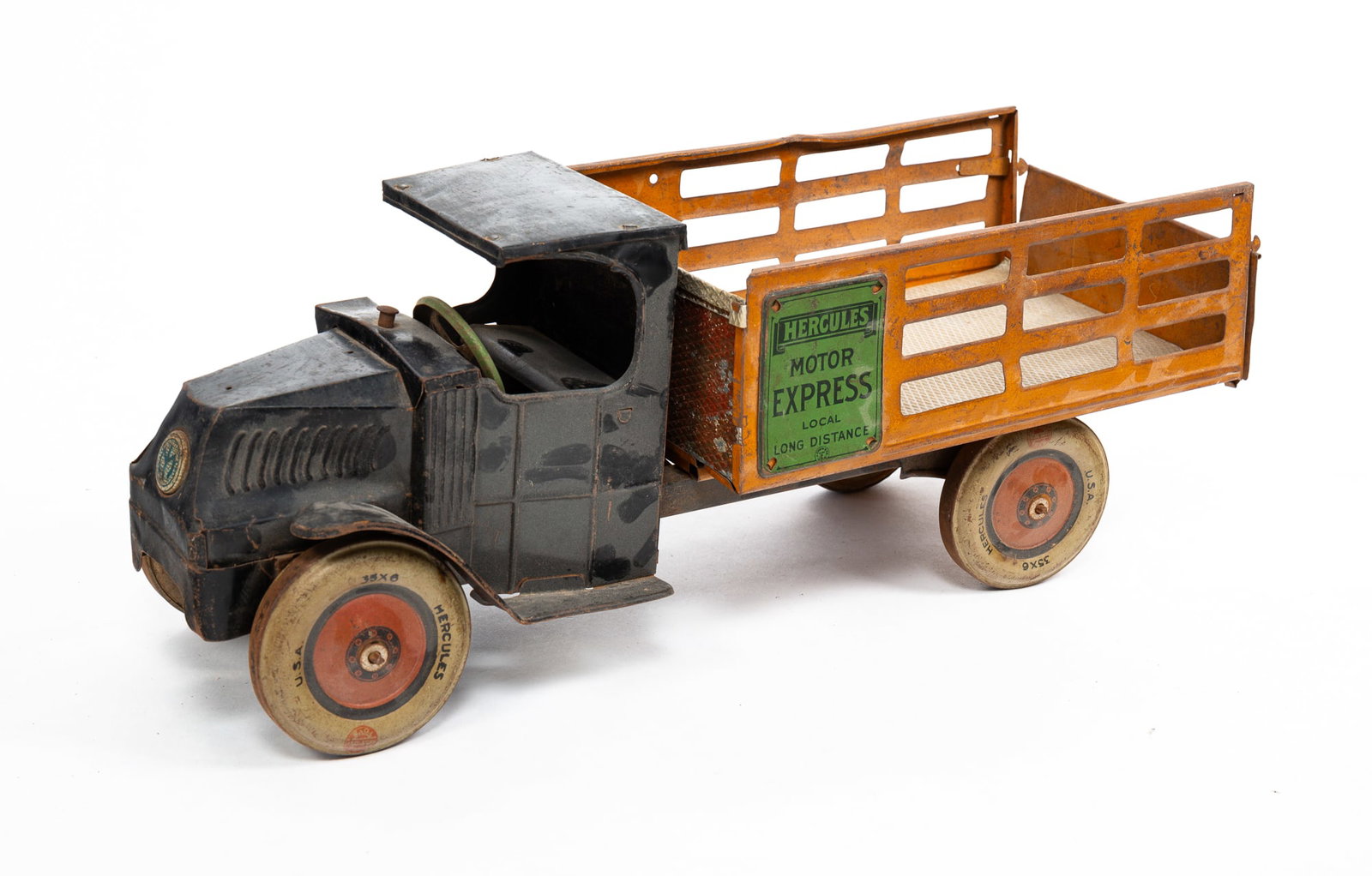 J. CHEIN TOY COMPANY DELIVERY TRUCK.: American, second quarter 20th Century. Die stamped tin. Worn original paint, some dents and bed liner replaced. 7.5"h. 19.5"l.