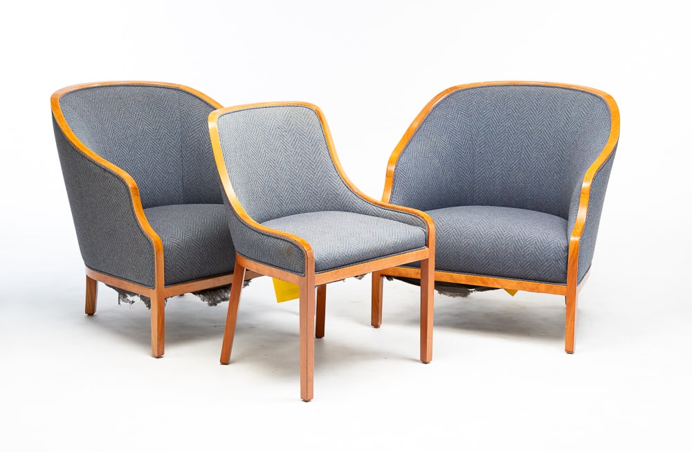 THREE WARD BENETT MODERN UPHOLSTERED CHAIRS.: American, third quarter 20th Century. For Brickel Associates. Sculpted blue-grey upholstered armchairs, 32"h. 30"w. And one matching side chair, 32"h. 23"w. Surface wear.