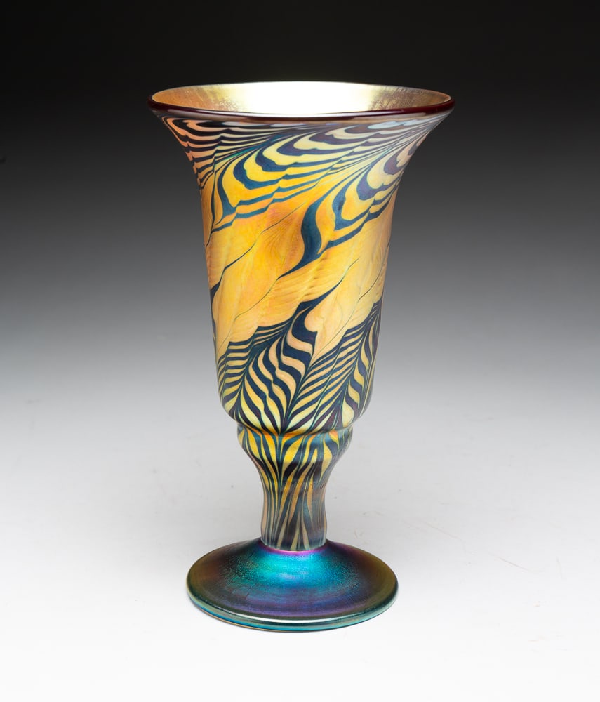 LUNDBERG STUDIOS ART GLASS VASE.: American (Davenport, California), dated 2001. Trumpet shape with stem and foot, gold iridized with pulled feather pattern. Broken pontil. Signed, dated and numbered 102810. 8.5"h.