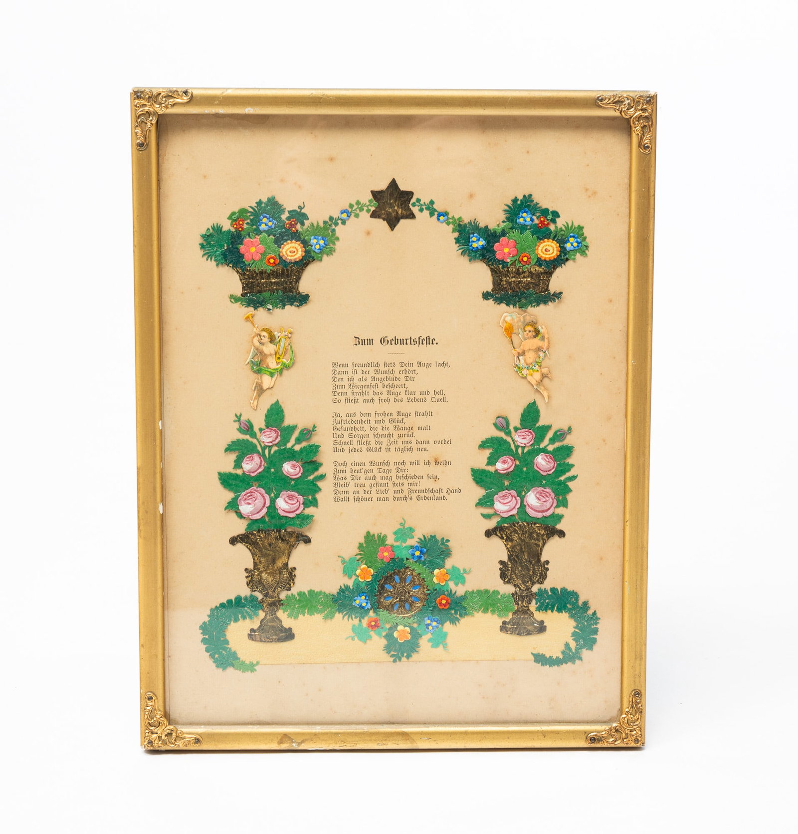 FRAMED BIRTHDAY WISH.: German, mid-19th Century. Paper cut outs around a German poem. Toning and wear. 13.25"h. 10.25"w.