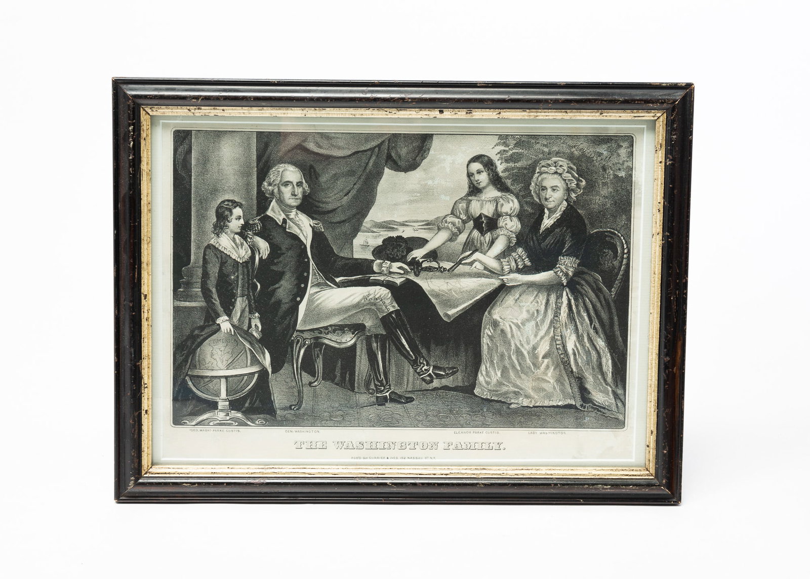CURRIER & IVES "THE WASHINGTON FAMILY" PRINT.: American, second-half 19th Century. Small folio. George Washington with his family members. In black and white. Toning, discoloration and wear to frame. 12"h. 15.5"w.