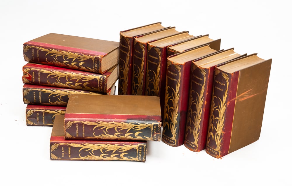 THIRTEEN VOLUMES OF JAMES FENIMORE COOPER'S WORKS.: American (New York), late-19th Century. Pathfinder Edition limited to one thousand copies of which these are numbered 577. Gold tooled leather spines. Some wear and leather cracking.