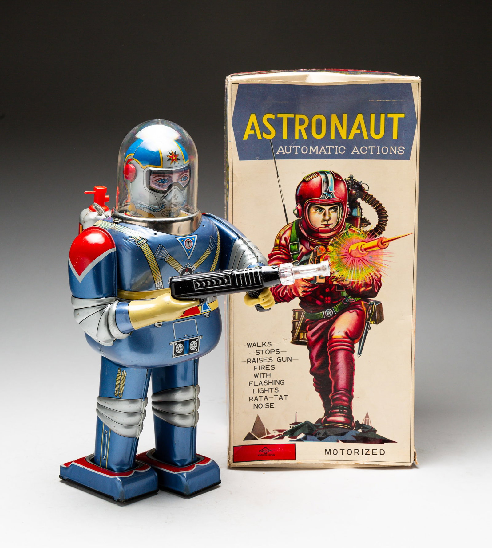 BOXED TIN ROBOT BY DAIYA.: Japanese, circa 1960. Battery operated astronaut robot in blue. In original box. 13.75"h.