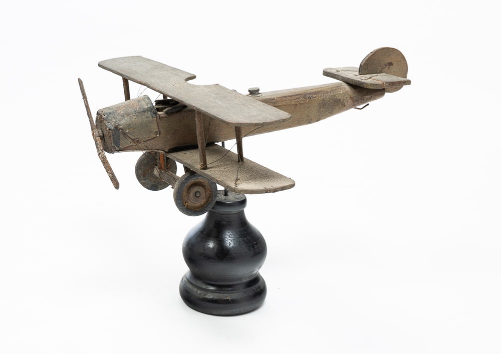 MODEL WWI AIRPLANE.: American, circa 1915. Wooden three wing, single seat fighter plane with alligatored finish. On stand. Wear and repairs. 9.5"h. 14"d. 13"w.