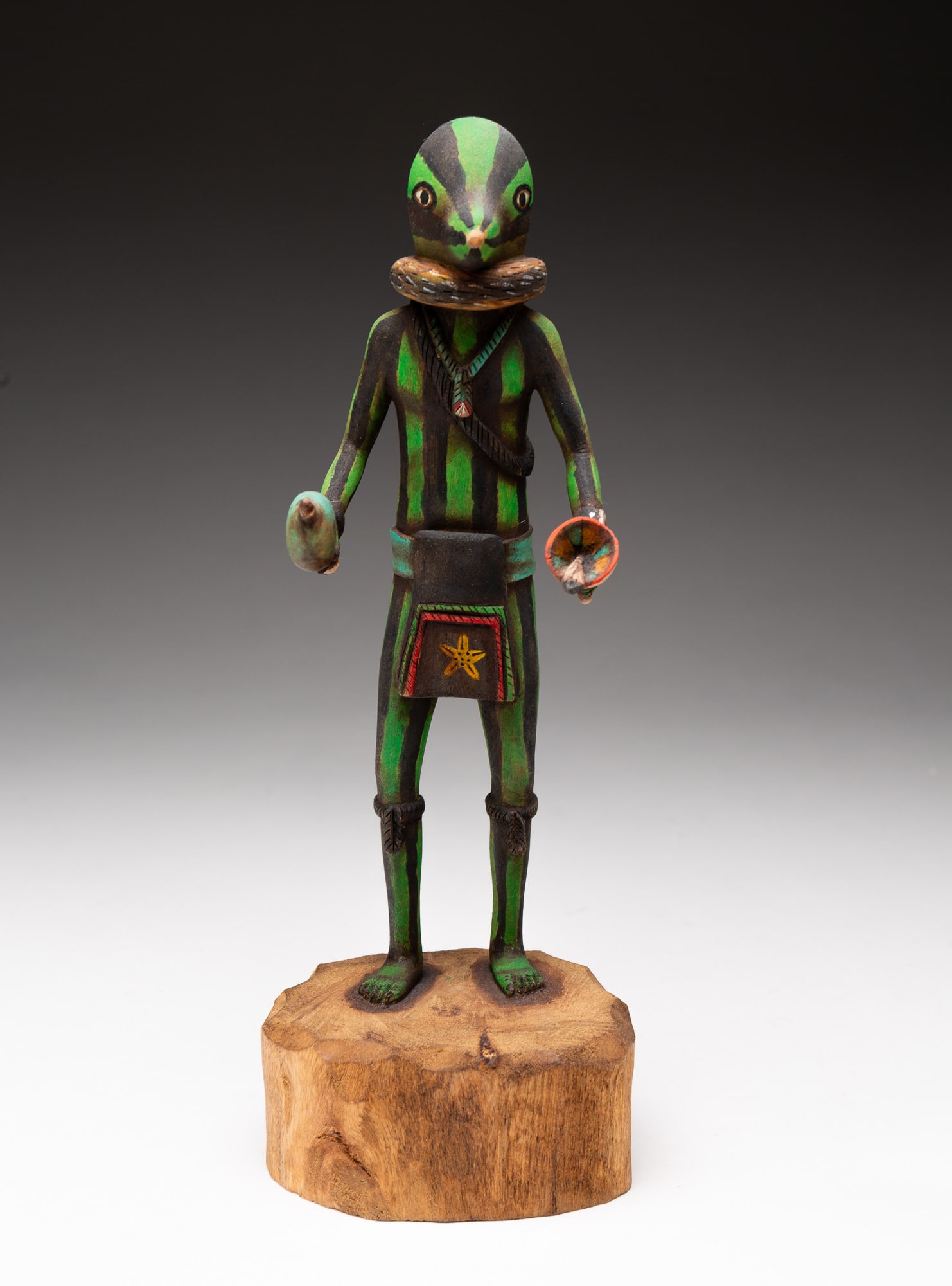 HOPI SQUASH KACHINA DOLL.: Hopi, late-20th or early-21st Century. Polychrome painted cottonwood. Signed "Jonathan Day" on underside. 11.5"h.