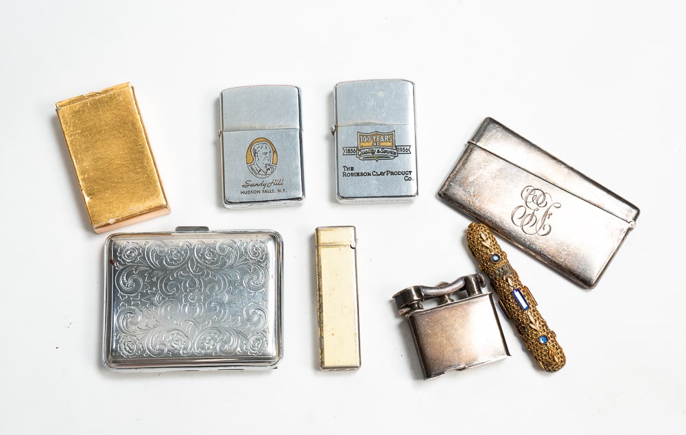 GROUP OF CIGARETTE CASES AND LIGHTERS.: 20th Century. Comprising a sterling silver Gorham vesta case engraved with initials "GF," marked; an etched silver cigarette case; a sterling silver Goodrich Euzkadi lighter, marked; a brass Japanese