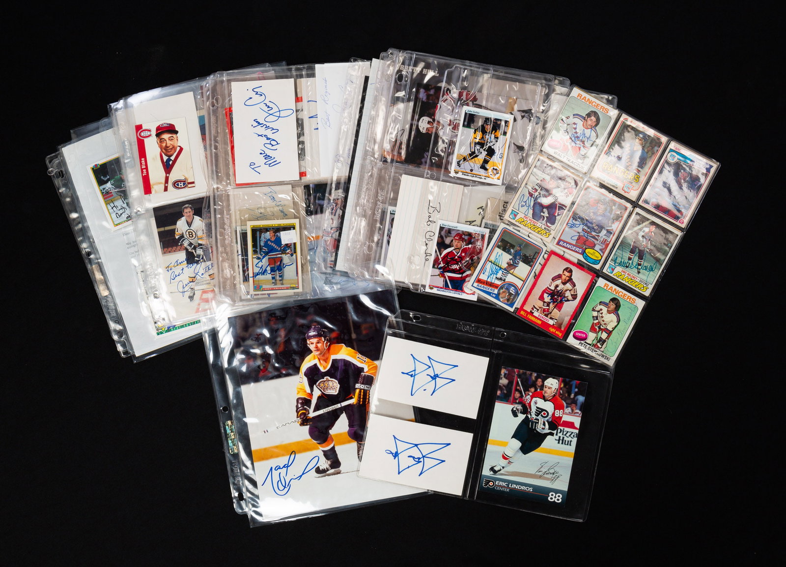 COLLECTION OF AUTOGRAPHED HOCKEY MEMORABILIA.: American, 20th Century. Includes signed player cards, photographs, newspaper clippings, index cards. Featuring signatures from Jimmy Carson, Brett Hull, Steve Yzerman, Brendan Shanahan, Dino Ciccarell