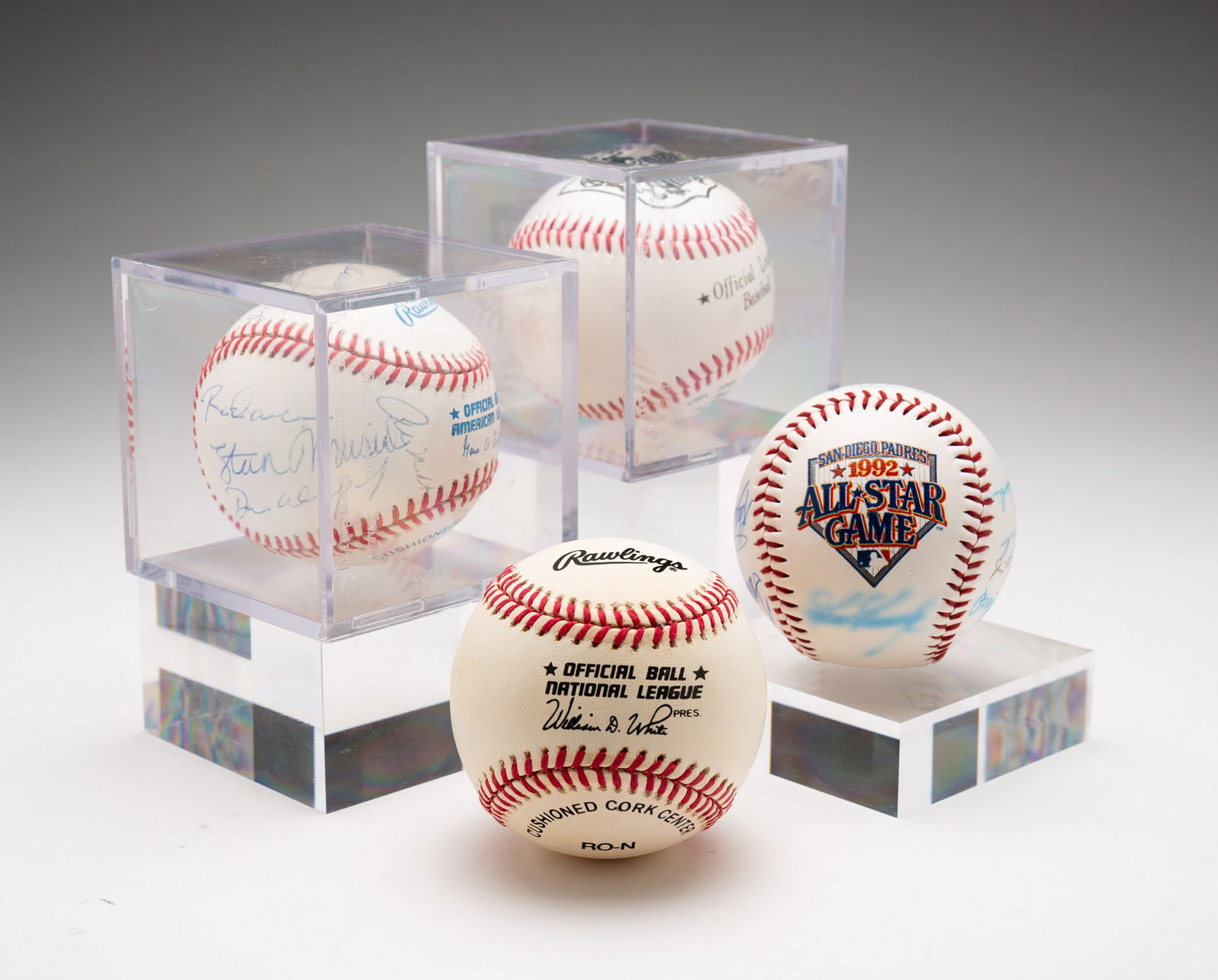 FOUR AUTOGRAPHED BASEBALLS.: American, 20th Century. Includes 1992 All-Star Padres team signed balls; a multi-signature ball with Pete Rose, Stan Musial, Al Kaline and others; Don Drysdale autographed ball; and a Leo Durocher sig