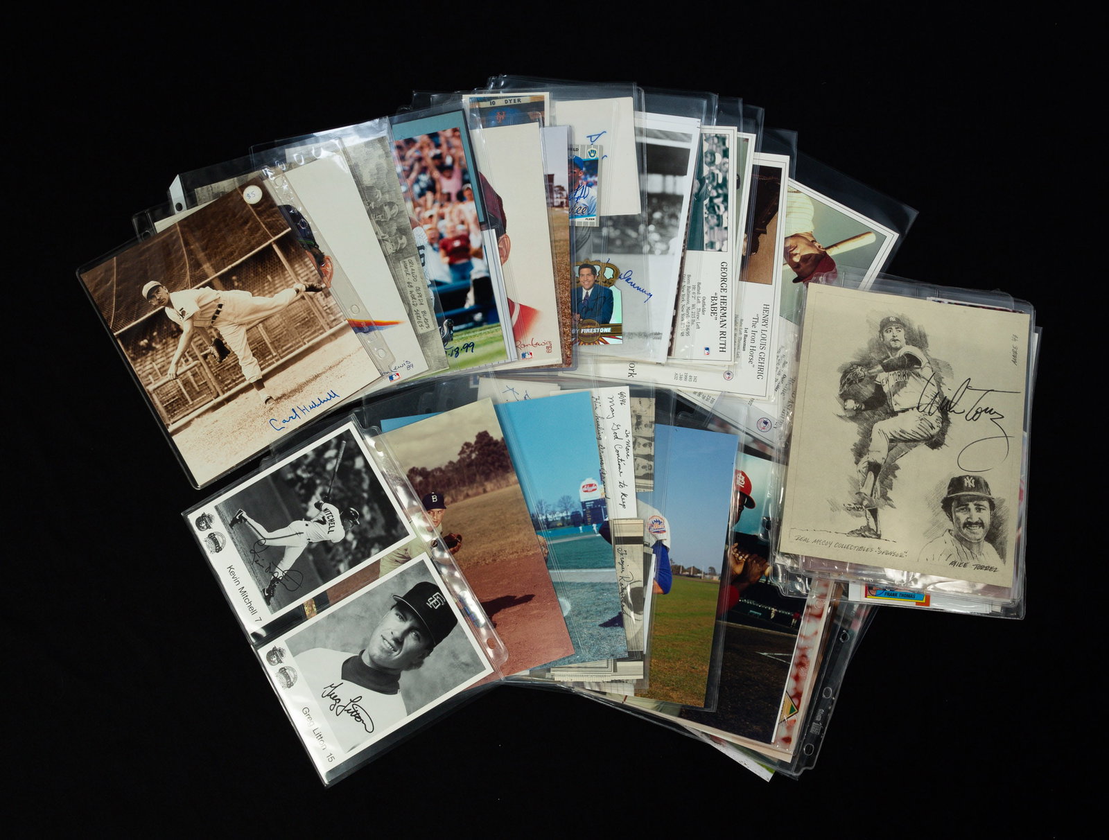 COLLECTION OF AUTOGRAPHED BASEBALL MEMORABILIA.: American, 20th Century. Includes signed baseball cards, photographs, newspaper clippings and index cards. Featuring signatures from Bob Lemon, Lefty Gomez, Henry "Slow Hank" Frazier Robinson, Kevin Mi