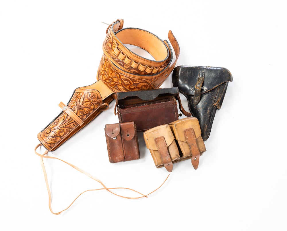 FIVE ANTIQUE LEATHER GOODS.: Three bullet cases, a NAZI P-38 holster and one Western tooled holster.
