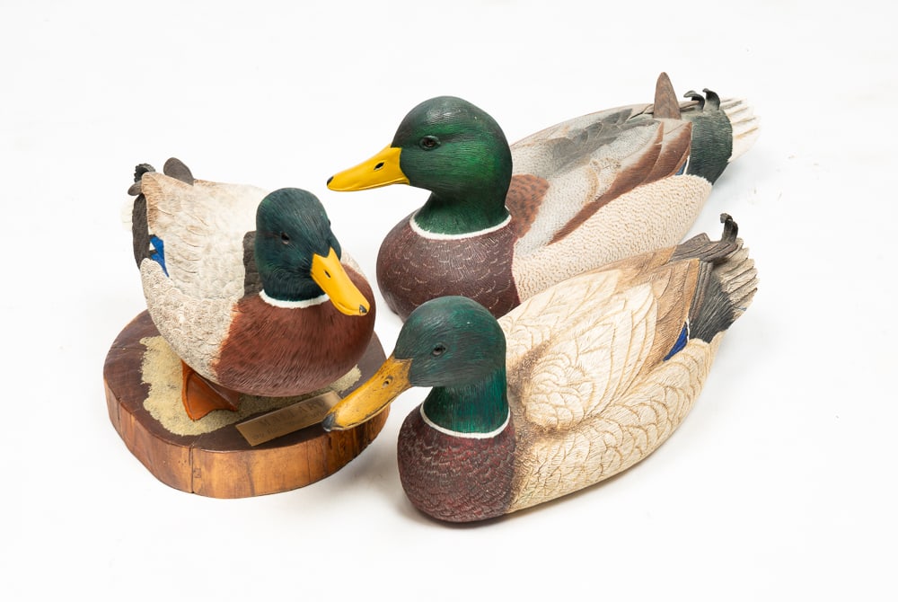 THREE PAINTED WOOD DRAKE MALLARD DECOYS.: American, late-20th Century. The first signed by Tom Penrod on underside, the second signed by Elizabeth Piper, the third mounted on a finished wood slice base with a plaque reading "By Asa 'Bud' Whee