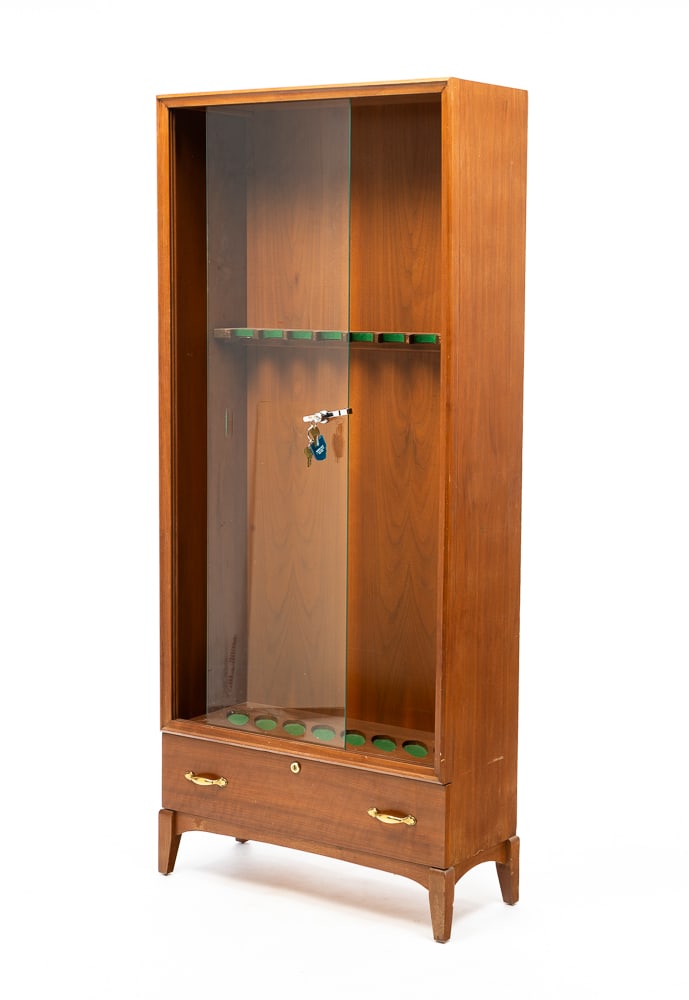 CONTEMPORARY GUN CABINET.: American, late-20th Century. Spaces for eight shotguns or rifles, lower drawer and square legs. One glass door was broken. 65"h. 28"w. 12"d.