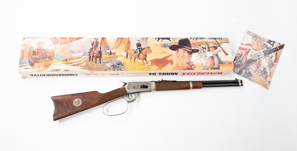JOHN WAYNE COMMEMORATIVE 1894 WINCHESTER RIFLE.: Chambered, carbine. 32-40 caliber. Unfired in original box with papers. Excellent condition.Serial number 30263.*FFL requirements apply.