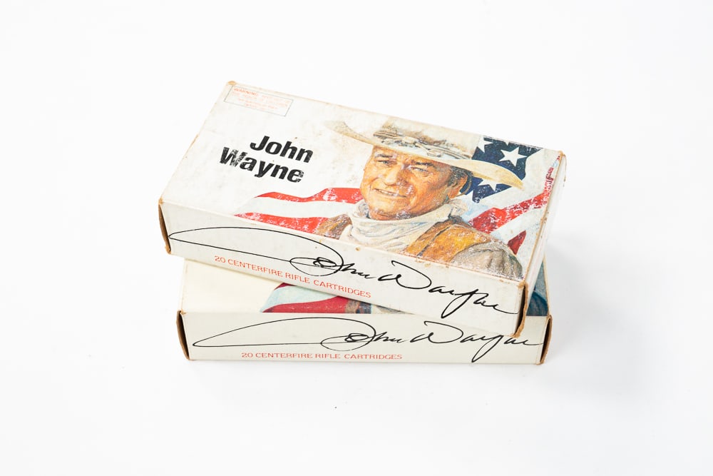TWO FULL BOXES OF JOHN WAYNE COMMEMORATIVE 32-40 RIFLE CARTRIDGES.: All like new, in boxes.