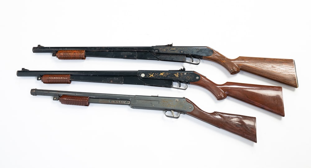 THREE DAISY PUMP BB GUNS.: Daisy 760 Pump Rapid fire, modified to prevent firing. Otherwise fair condition. And two Daisy Model 25s. Both overall fair condition