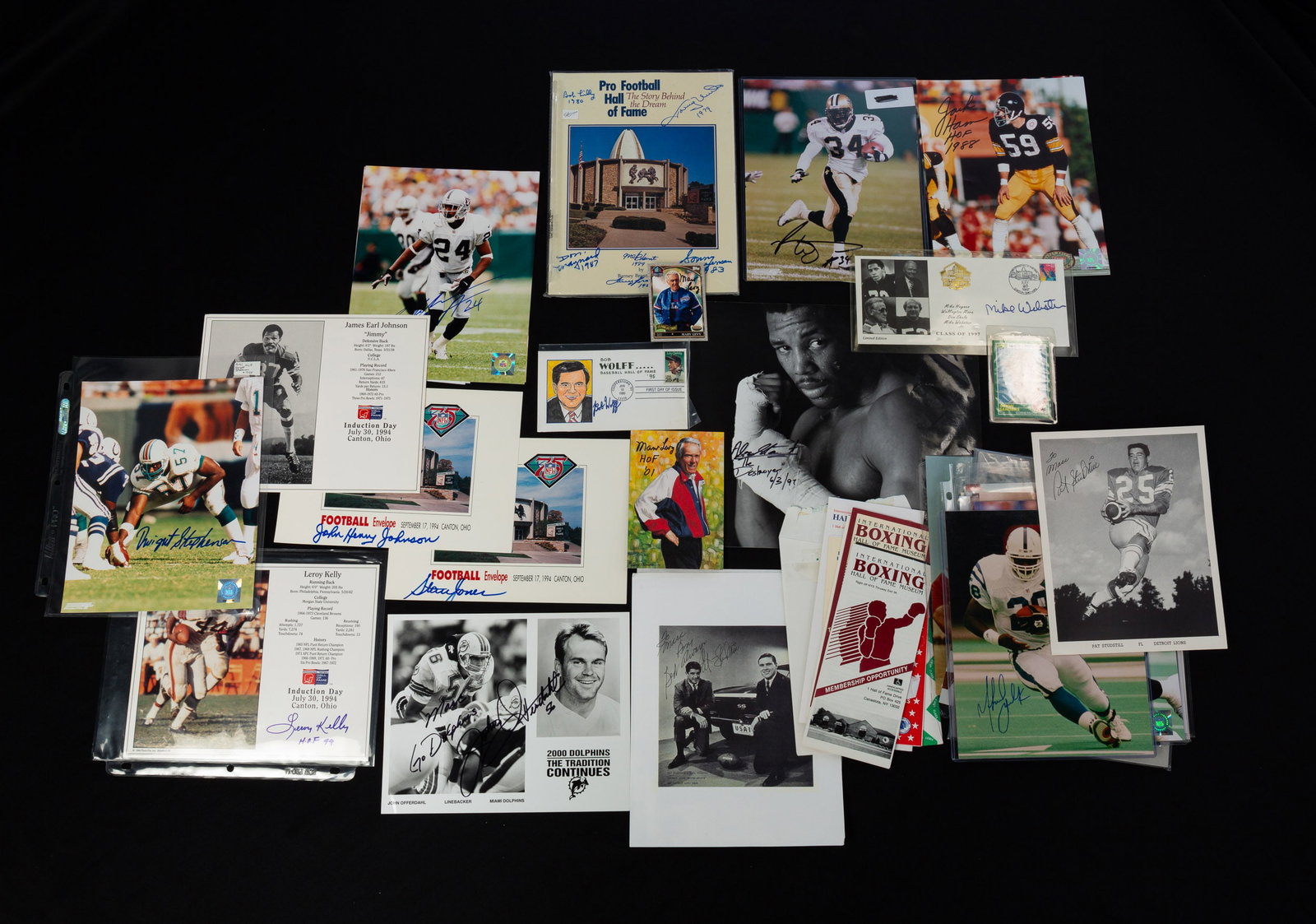 COLLECTION OF PROFESSIONAL ATHLETE MEMORABILIA.: American, 20th Century. Mostly all autographed. Includes signatures on photographs, flyers, trading cards and index cards. Featuring a Deion Sanders Rookie card and signatures from Charles Woodson, Er
