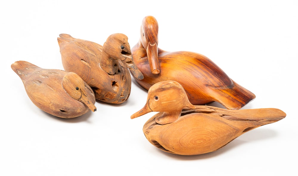 FOUR SIGNED WOOD DUCK DECOYS.: American, 20th Century. Three signed "S.C. Burton" and one signed "CROWELL." Largest 7"h. 14.5"l.