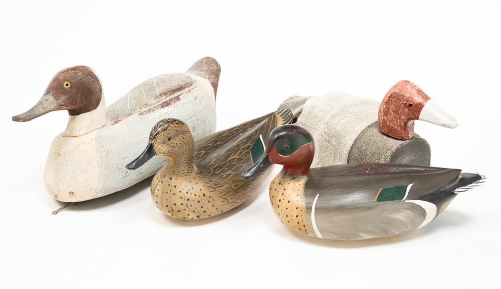 FOUR SIGNED WOOD DUCK DECOYS.: American, 20th Century. Two by Bill Goenne and marked "WRG" and "HALL," one marked "CROCKETT," and one with canvas by Richard Morgan and initialed "R.M." Largest 8"h. 17"l.
