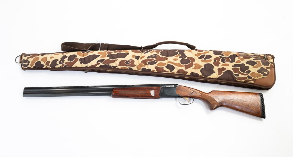 EAA CORPORATION OVER/UNDER 12 GAUGE SHOTGUN.: Russian (Baikal), late-20th Century. Model 1ZH-27EM-IC. Serial number 022749615 B. Nice condition with camouflage soft case. 45.25"l.