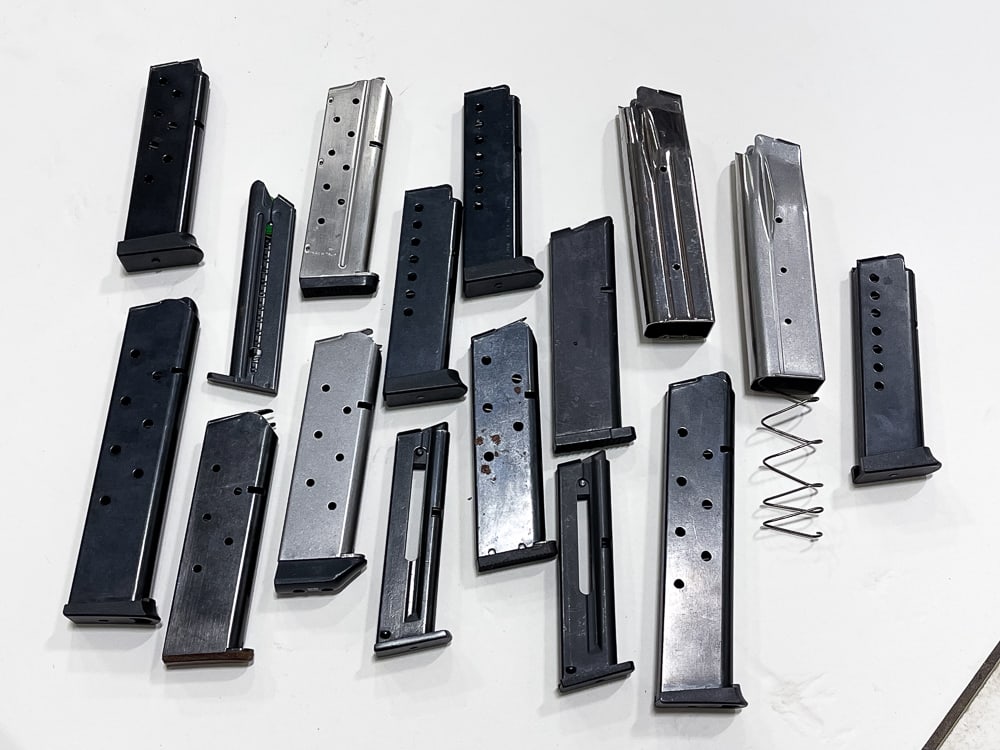 INTERESTING ASSORTMENT OF PISTOL MAGAZINES.: 16 magazines, including two Sig 9mm, 22 LR, 9mm, 45ACP, etc.
