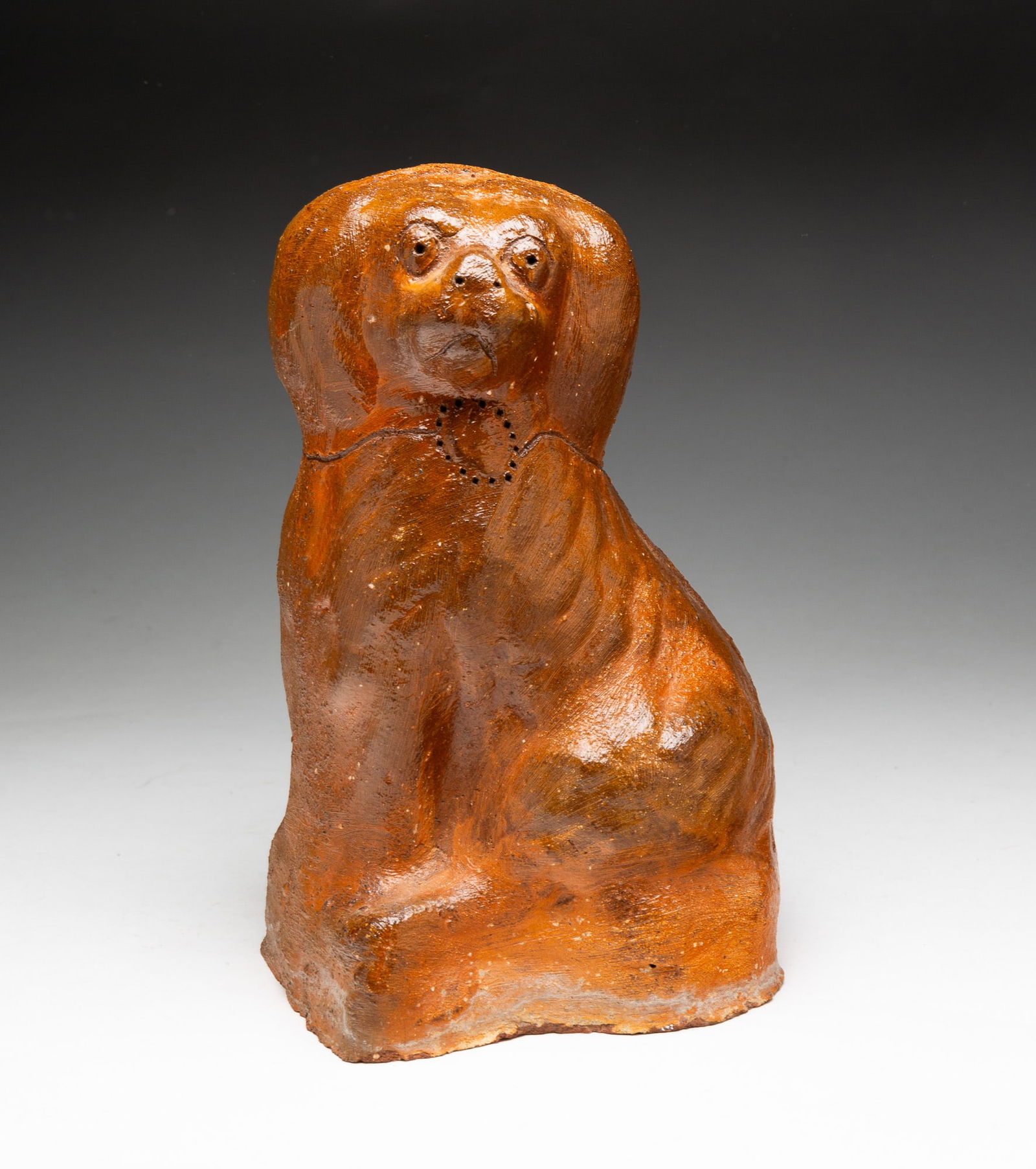 BRICK CLAY SEATED SPANIEL. (1 of 5)