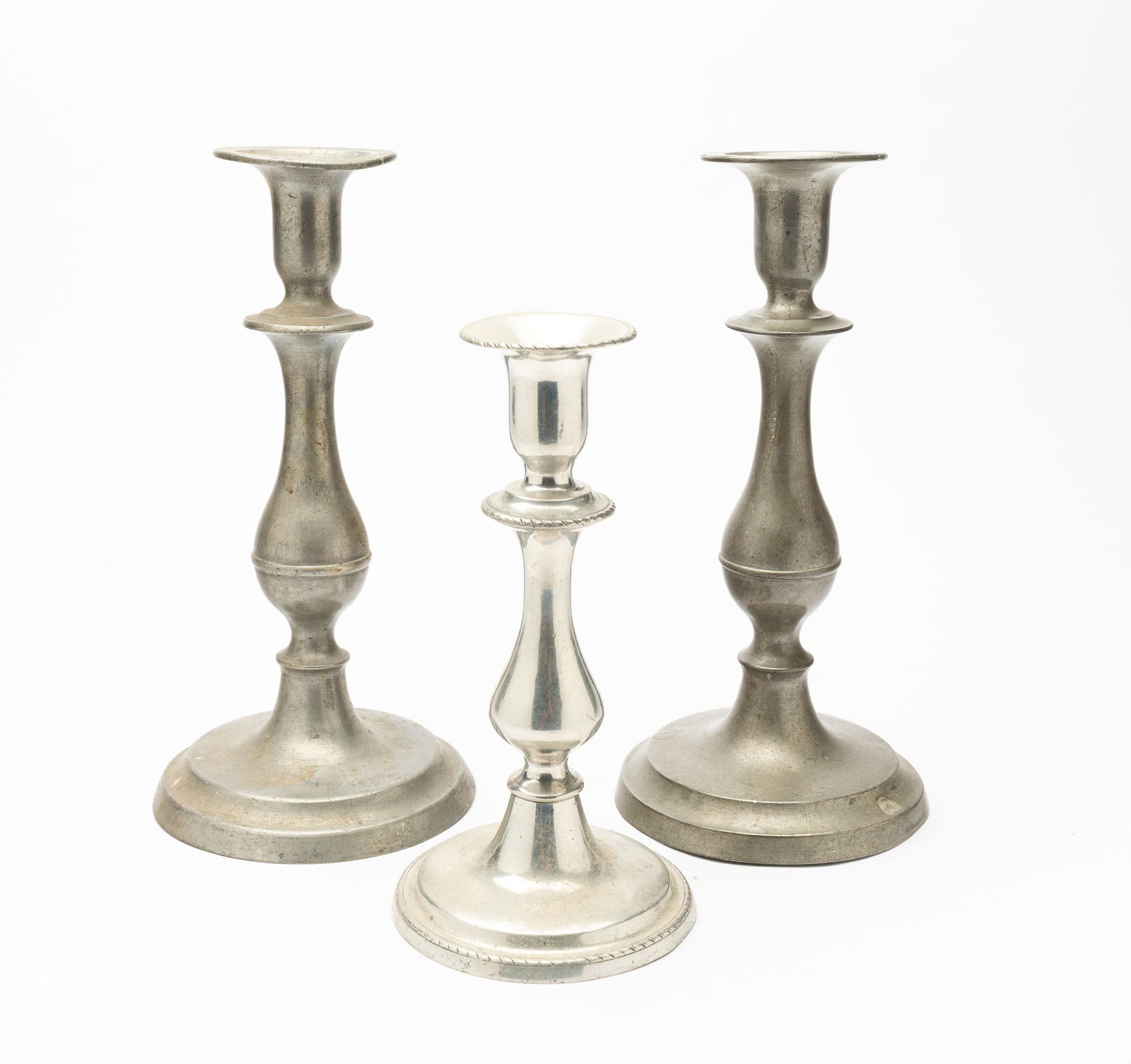 THREE PEWTER CANDLESTICKS. (1 of 3)