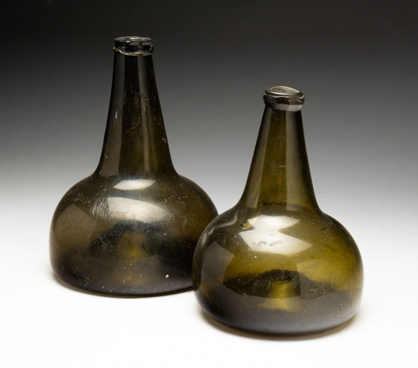 TWO FREE BLOWN OLIVE GREEN GLASS ONION BOTTLES. (1 of 4)