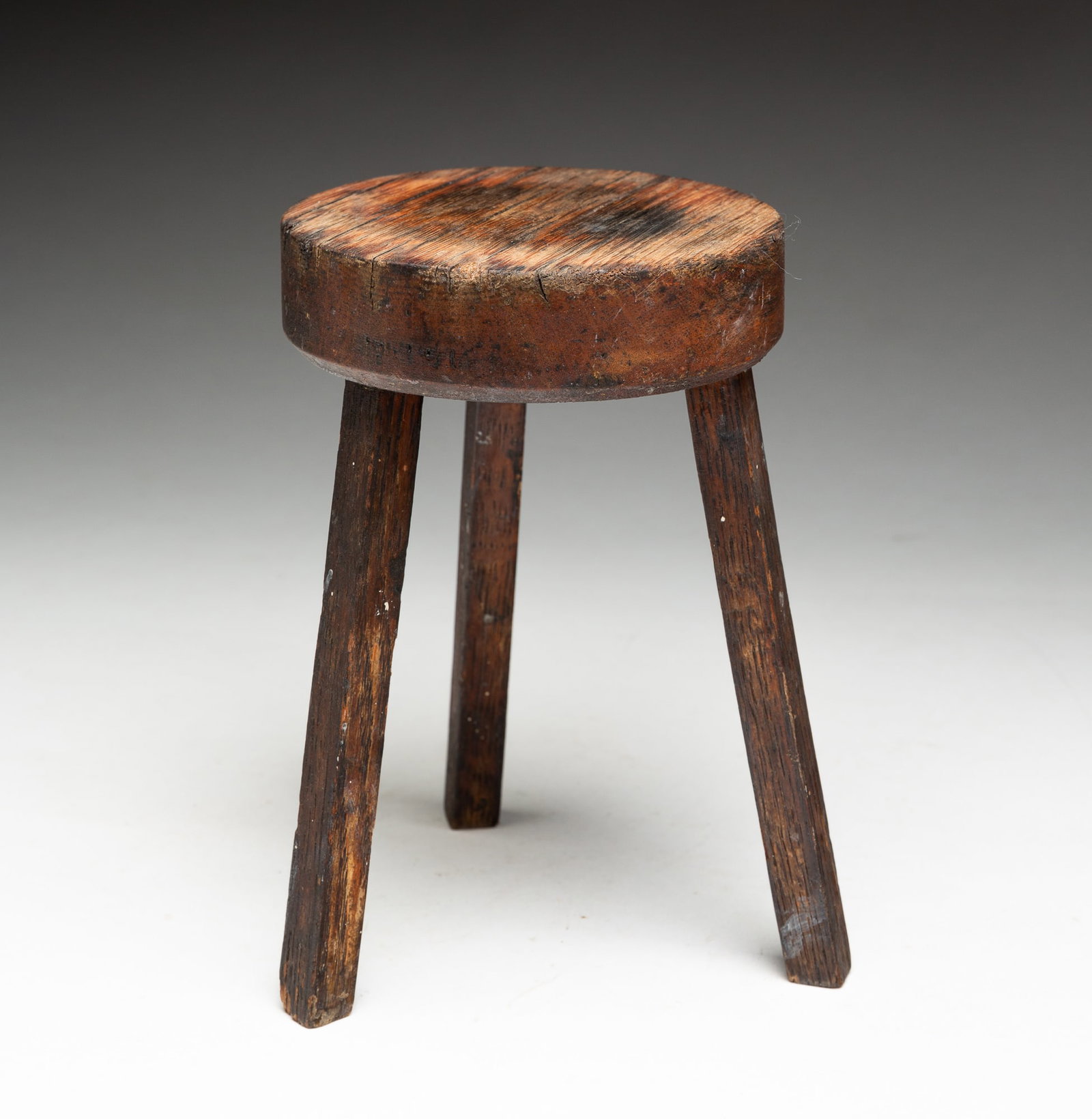 STOOL SHAPED LAMP TIDY.: STOOL SHAPED LAMP TIDY. American, 19th Century. Oak. Cricket style lamp tidy with splayed square legs. 7"h. From the collection of Carol Schulman (Chesterland, Ohio).