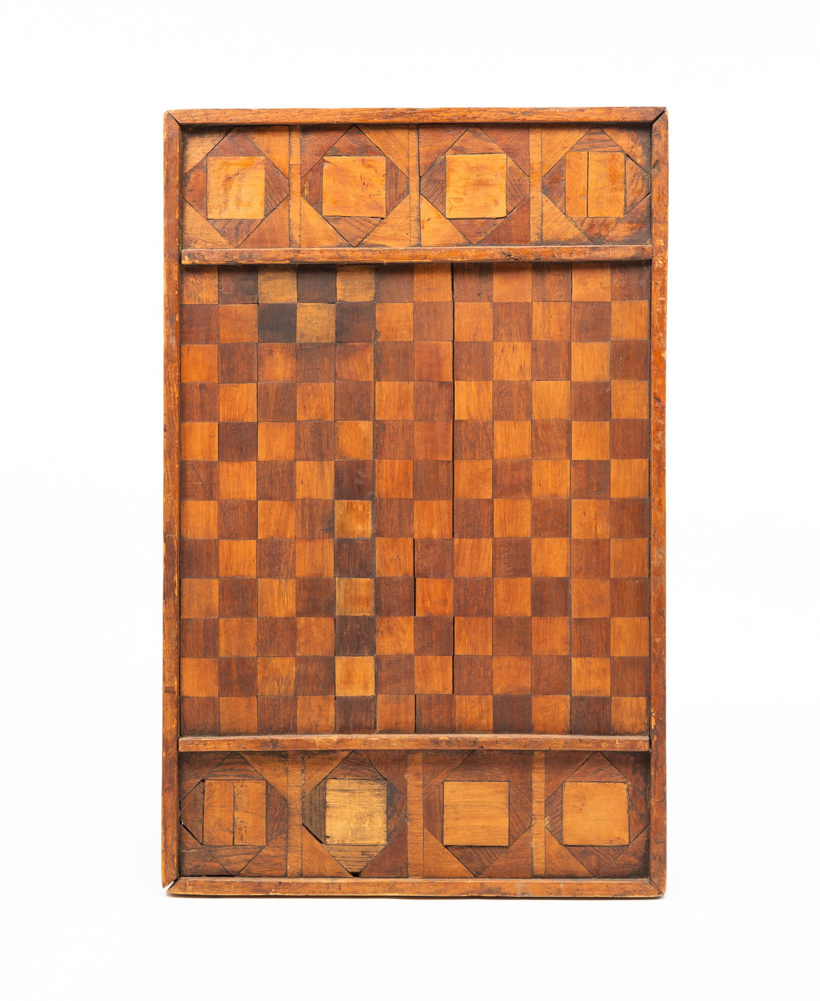 MARQUETRY GAME BOARD.: MARQUETRY GAME BOARD. American, 19th Century. Alternating veneered squares. Till to either end with geometric wood work and gallery edge. 30.25"h. 19.25"w. From the collection of Carol Schulman (Chest
