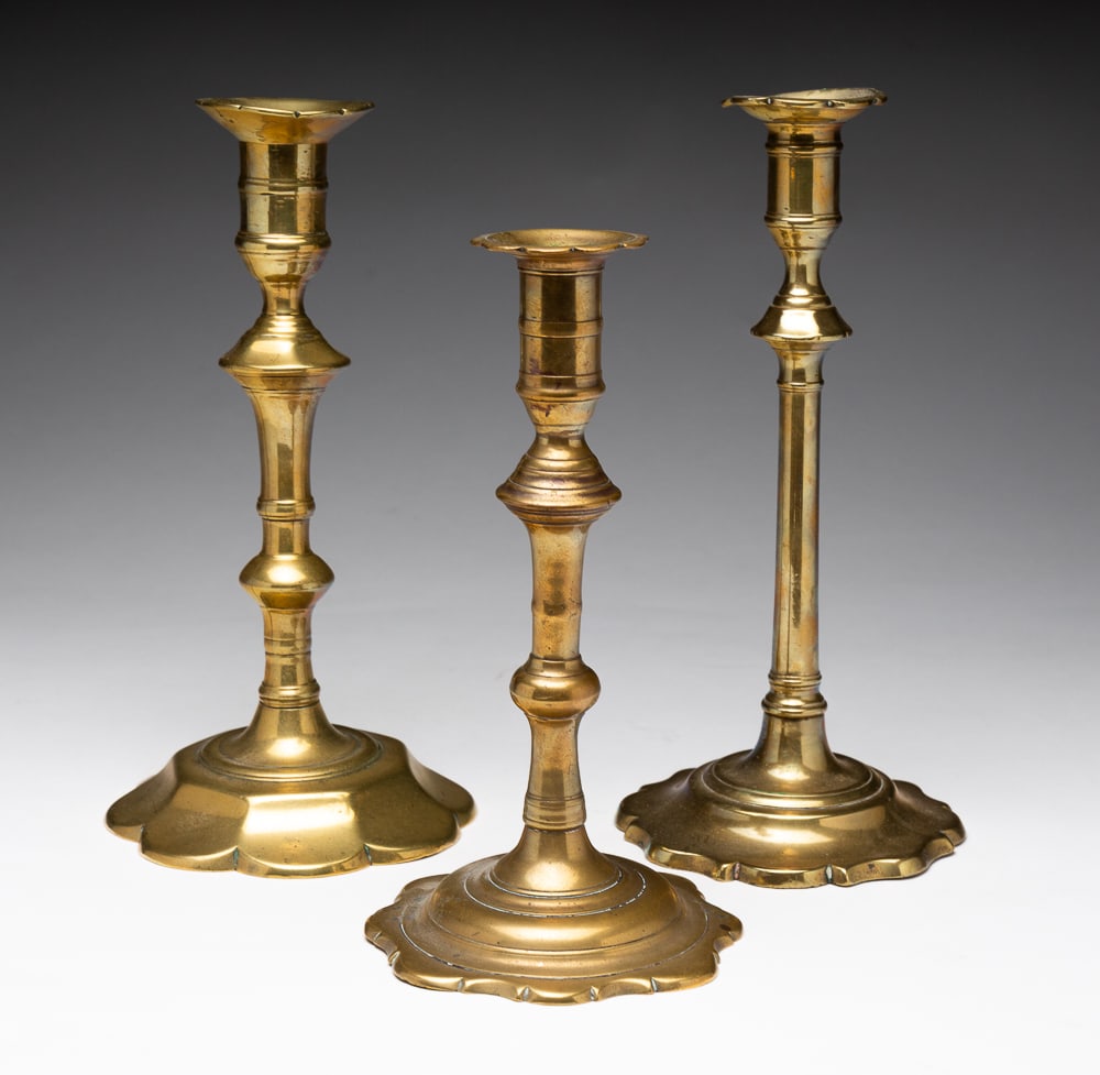 THREE QUEEN ANNE BRASS CANDLESTICKS. (1 of 4)