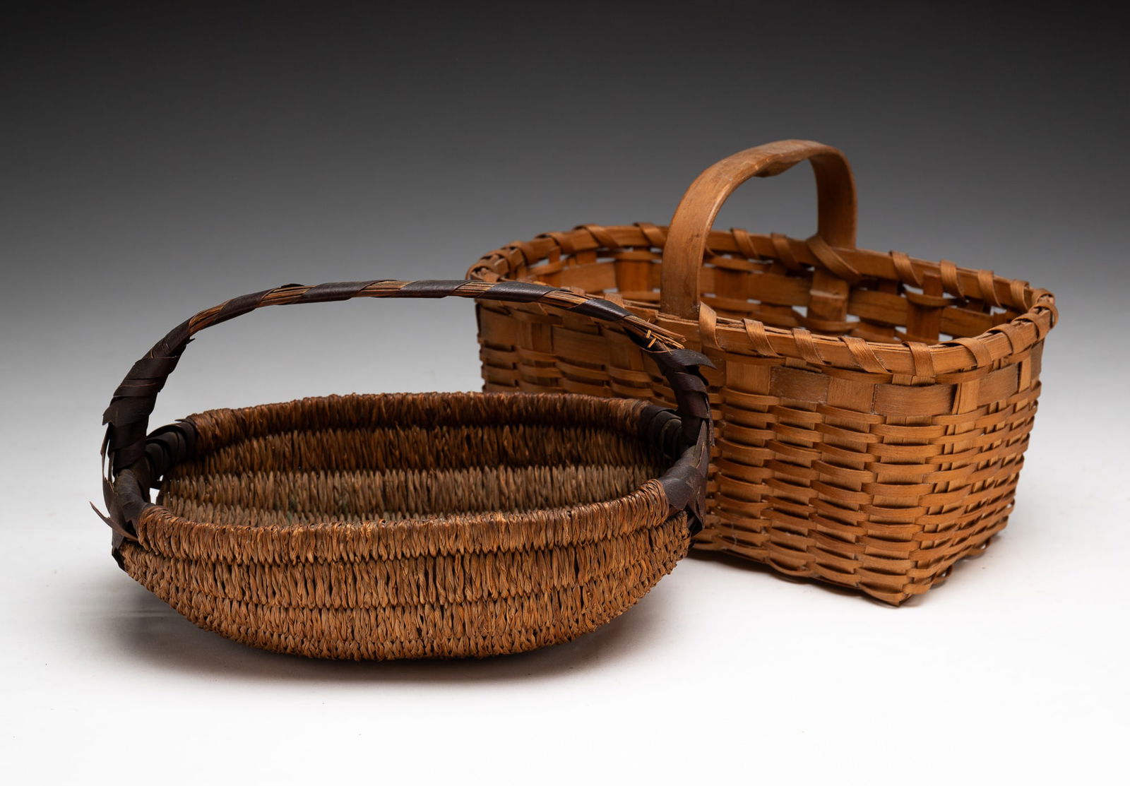 TWO DIMINUTIVE GATHERING BASKETS. (1 of 3)