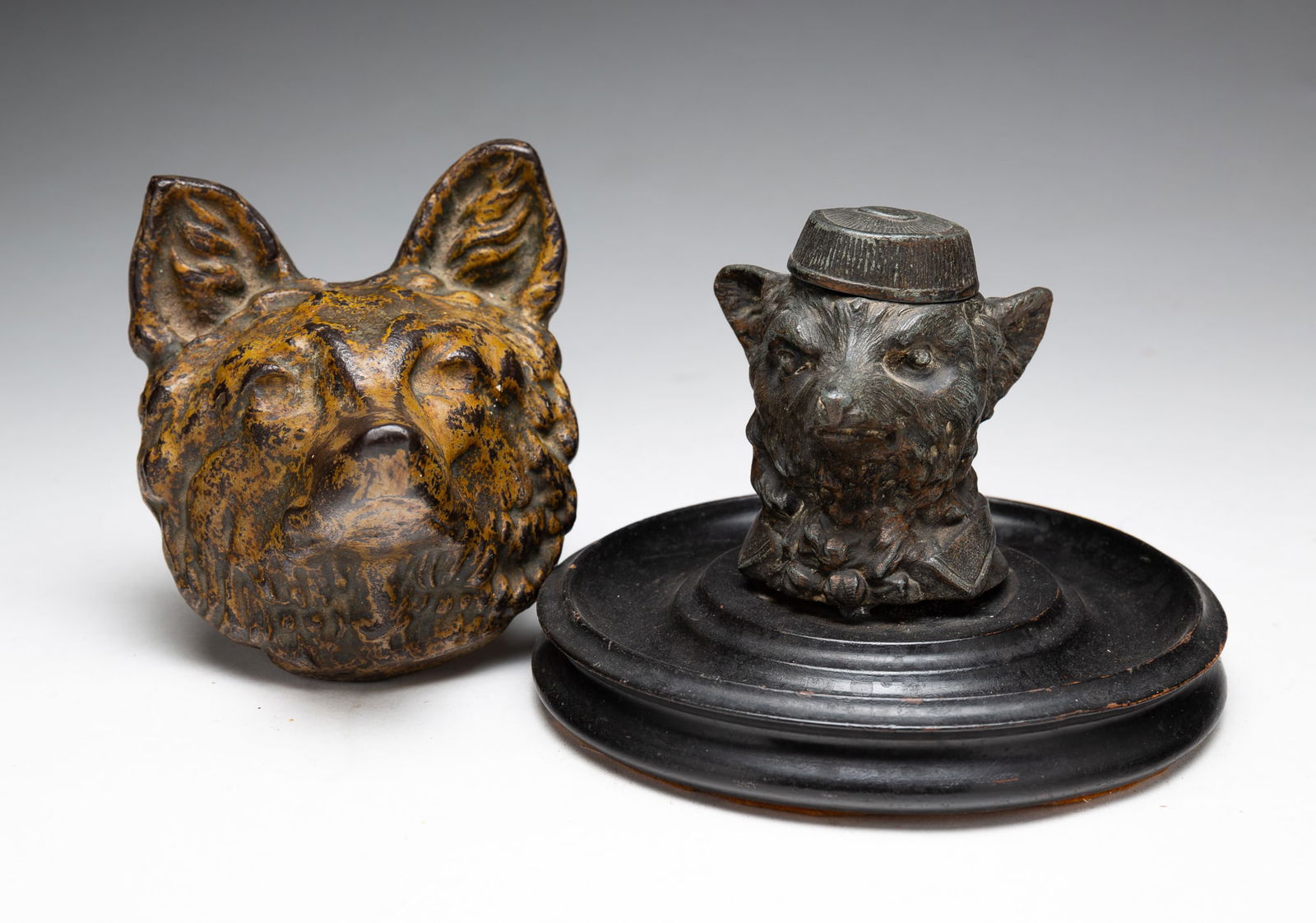 TWO CAST IRON FOX HEADS. (1 of 3)