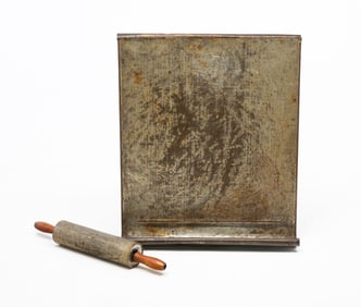 TIN DOUGH BOARD WITH TIN ROLLING PIN.