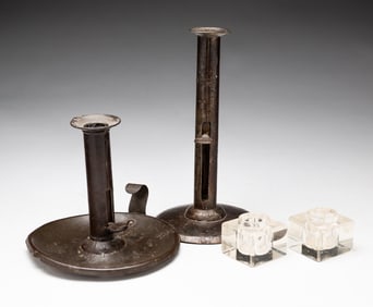 TWO TIN HOGSCRAPER PUSH UP CANDLESTICKS.