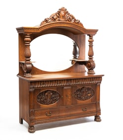 HEAVILY CARVED SIDEBOARD.
